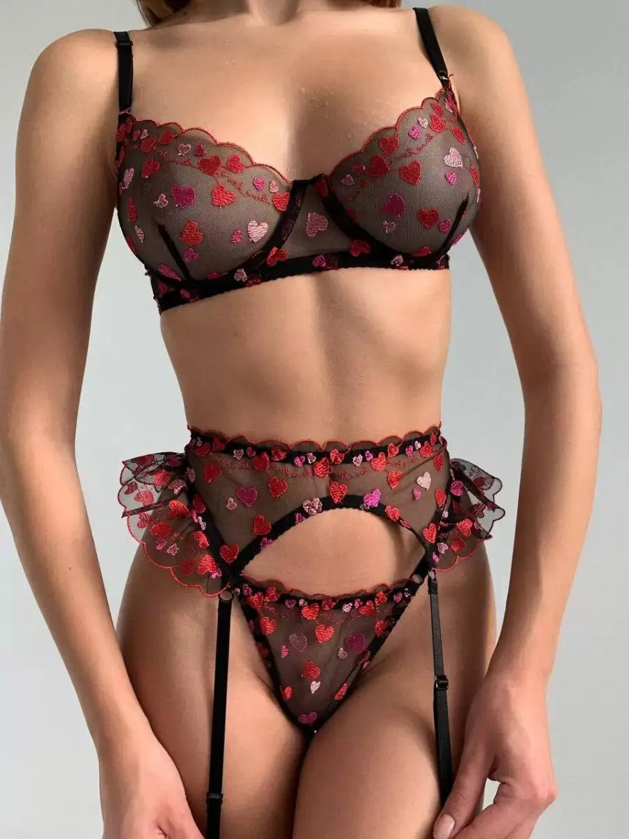 Lingerie set with heart patterns on a plain background