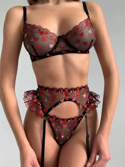 Lingerie set with heart patterns on a plain background
