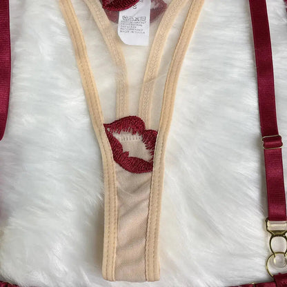 Close-up of a red and beige strap with floral design on a white background